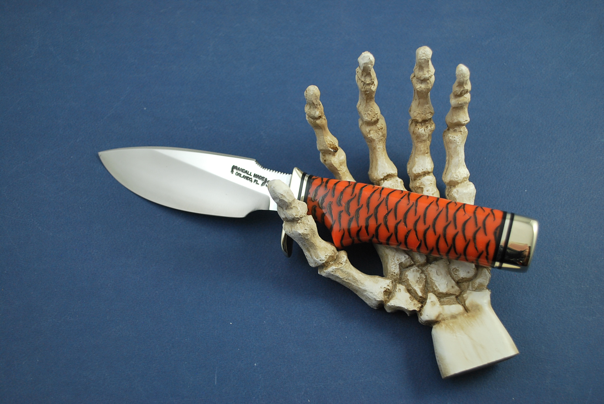 Randall 11 Orange Pine Cone Handle with Skeleton Hand